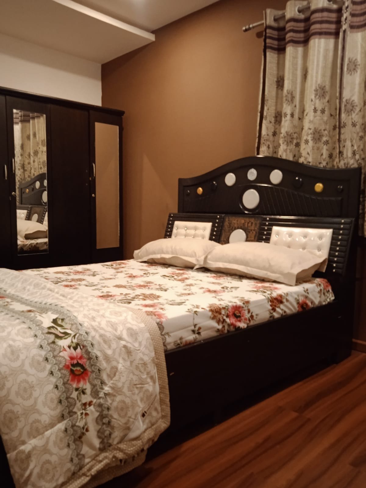 Premium master bedroom with large bed and wardrobe